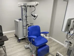 Front view of the TMS machine inside the room