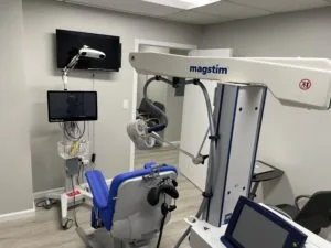 Back view of the TMS machine inside the room