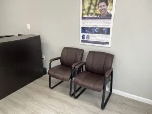 Two brown chairs in the office